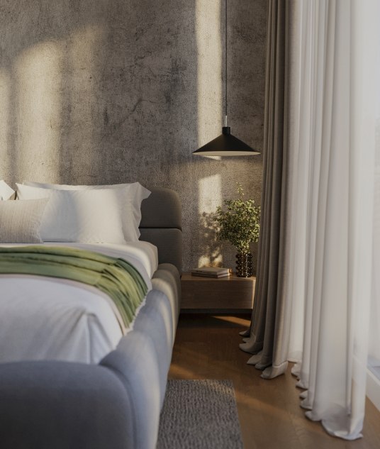 Luxuriöses Schlafzimmer mit grauer Akzentwand, stilvollen Hängelampen und einem gemütlichen Bett mit grünen Akzenten.